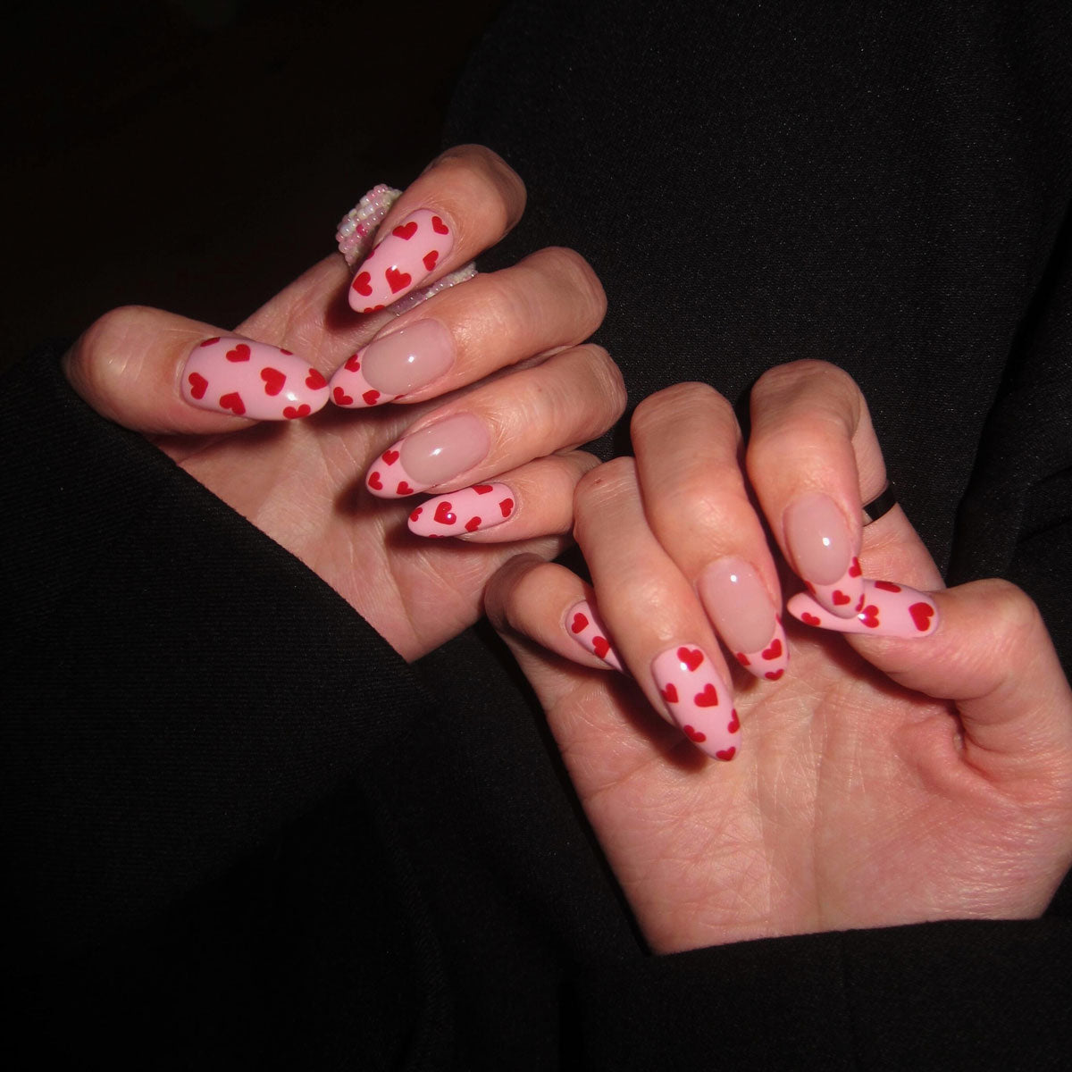 Glossy medium almond nails | baby pink + red hearts | sweet & flirty