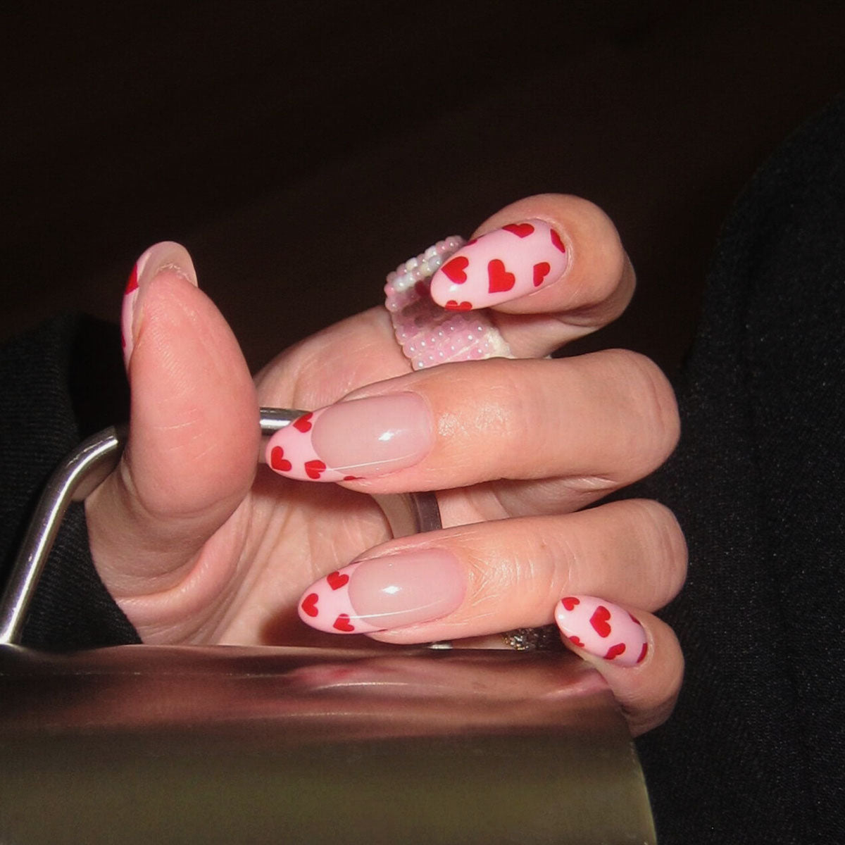 Glossy medium almond nails | baby pink + red hearts | sweet & flirty