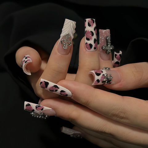 Medium square pink leopard print press-on nails with glitter, chrome cross and heart charms, punk Y2K style