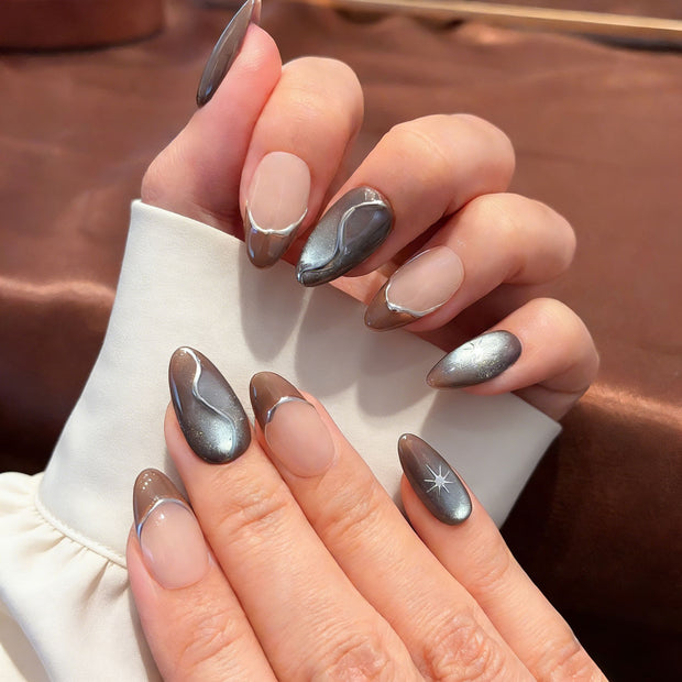 liquid metal silver cat eye press on nails, abstract wave fake nails, short almond shape acrylic nails, futuristic style nails, luxury handmade reusable nails, avant-garde nail art, women's daily wear fake nails, 2026 trendy futuristic nail