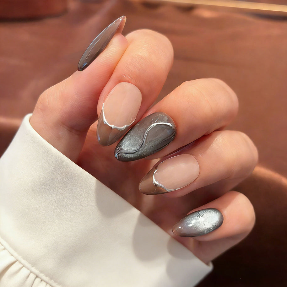 liquid metal silver cat eye press on nails, abstract wave fake nails, short almond shape acrylic nails, futuristic style nails, luxury handmade reusable nails, avant-garde nail art, women's daily wear fake nails, 2026 trendy futuristic nail