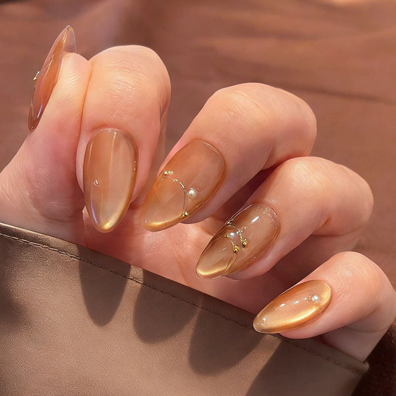 amber glow cat eye press on nails, gold line accents fake nails, short almond shape acrylic nails, romantic date nails, luxury handmade reusable nails, gentle daily wear nail art, women's office friendly fake nails, 2026 trendy amber nails