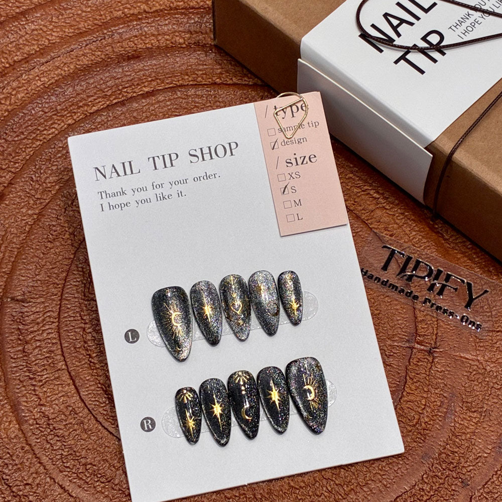 black gold glitter press on nails, celestial sun moon star fake nails, stiletto shape acrylic nails, gothic luxury reusable nails, Halloween party festival nails, 3D gold totem nail art, edgy daily wear fake nails, 2026 trendy gothic nails