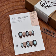 liquid metal silver cat eye press on nails, abstract wave fake nails, short almond shape acrylic nails, futuristic style nails, luxury handmade reusable nails, avant-garde nail art, women's daily wear fake nails, 2026 trendy futuristic nail