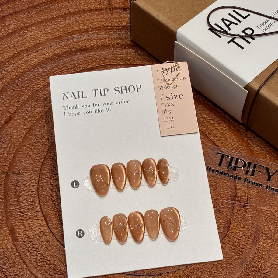 amber glow cat eye press on nails, gold line accents fake nails, short almond shape acrylic nails, romantic date nails, luxury handmade reusable nails, gentle daily wear nail art, women's office friendly fake nails, 2026 trendy amber nails