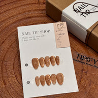 amber glow cat eye press on nails, gold line accents fake nails, short almond shape acrylic nails, romantic date nails, luxury handmade reusable nails, gentle daily wear nail art, women's office friendly fake nails, 2026 trendy amber nails