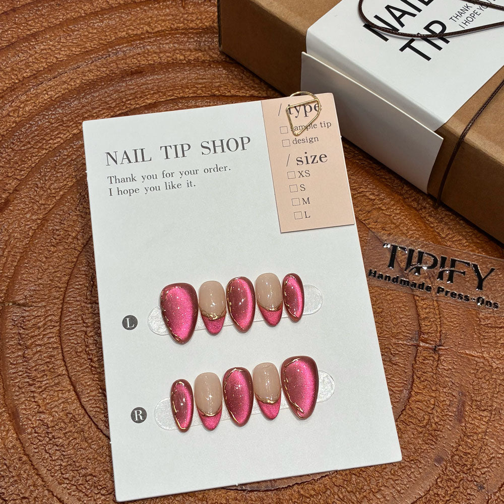 blush gild cat eye press on nails, gilded french accent fake nails, short almond shape acrylic nails, romantic date nail art, luxury handmade reusable nails, office party fake nails, 2026 trendy pink gold nails, women's daily wear cat eye nails